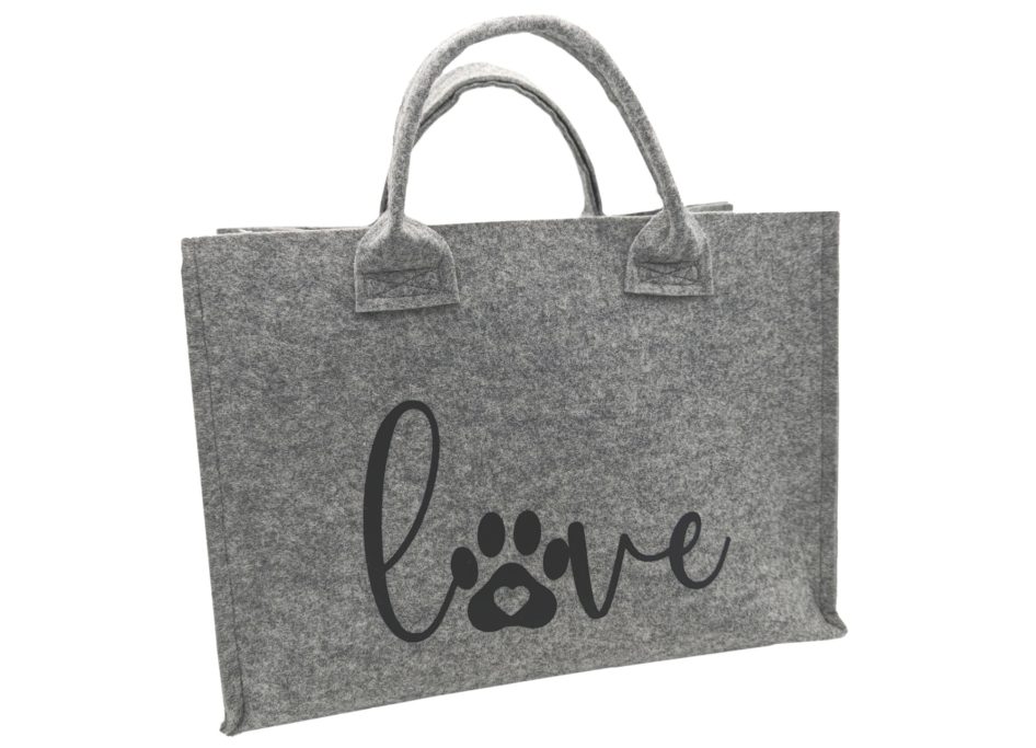 Graue Tasche mit dem aufgedruckten Wort "love" und einer Pfotenabdruck-Silhouette.